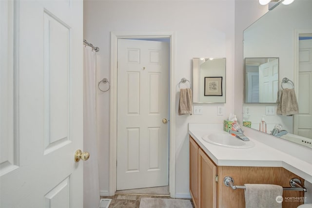 bathroom with vanity and walk in shower