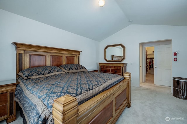 bedroom with light carpet and vaulted ceiling