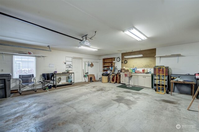 garage featuring a workshop area and a garage door opener