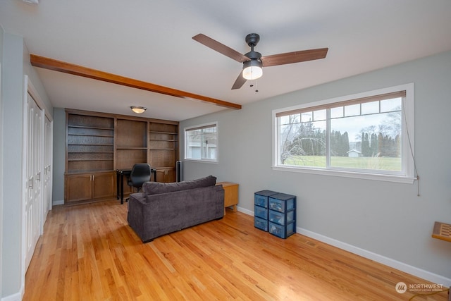 living room with beam ceiling, light wood-type flooring, built in features, and ceiling fan