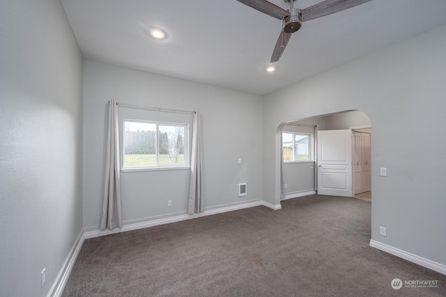 empty room featuring carpet and ceiling fan