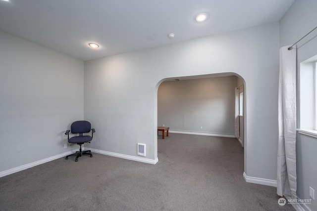 unfurnished room featuring carpet flooring