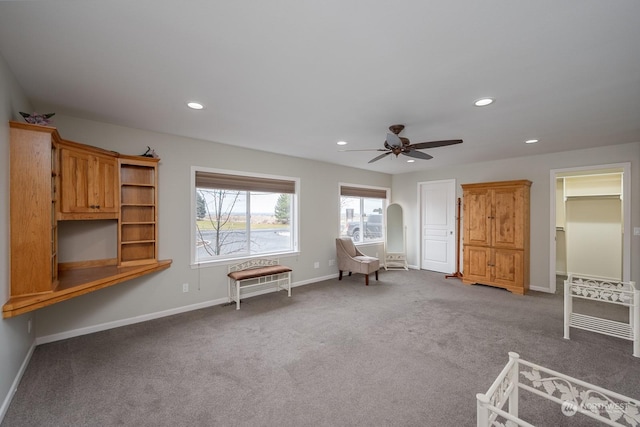 unfurnished room featuring carpet and ceiling fan