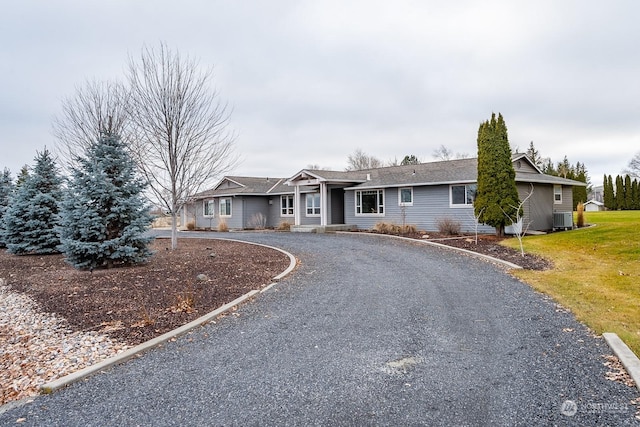 ranch-style house featuring central air condition unit