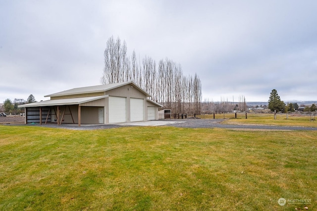 view of property exterior with a lawn, a garage, and an outdoor structure