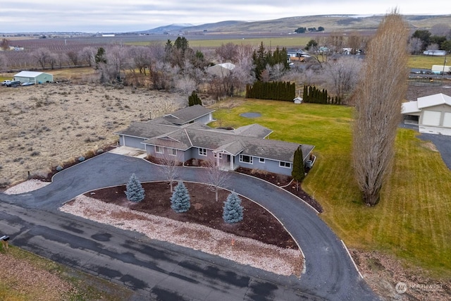 birds eye view of property with a mountain view