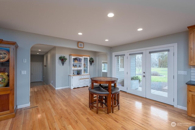 dining area featuring light hardwood / wood-style floors and french doors