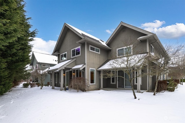 view of snow covered house