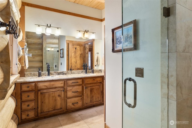 bathroom featuring vanity, tile patterned floors, and walk in shower