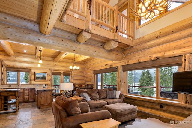 living room with rustic walls, an inviting chandelier, a towering ceiling, wooden ceiling, and beamed ceiling