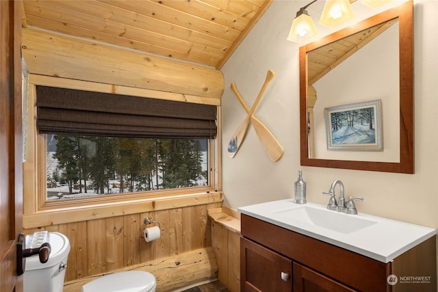 bathroom with vaulted ceiling, toilet, wooden ceiling, and vanity