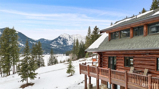 view of snowy exterior with a mountain view