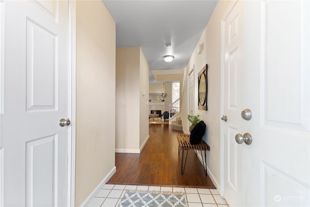 corridor with light tile patterned floors