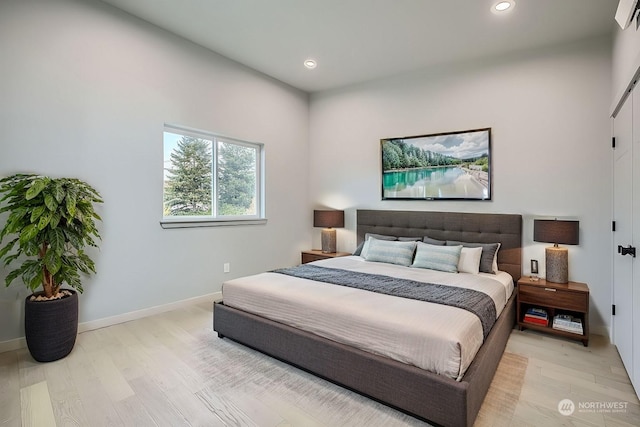 bedroom with light hardwood / wood-style floors