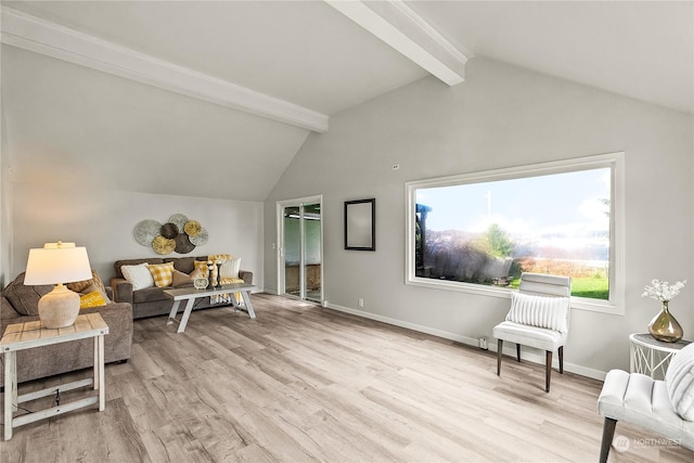 living area featuring light wood-type flooring and vaulted ceiling with beams