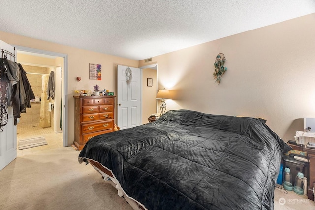 carpeted bedroom featuring a textured ceiling