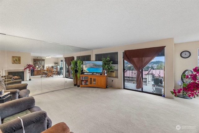 carpeted living room with cooling unit and a textured ceiling