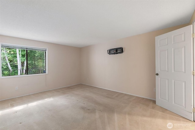 908 E Bay Dr NE Unit 203, Olympia, WA 98506 - unfurnished room with light colored carpet and baseboards