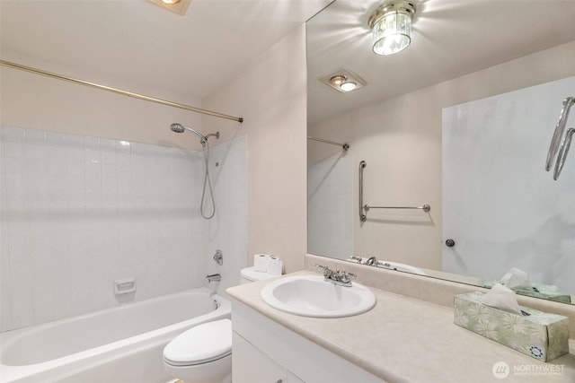 908 E Bay Dr NE Unit 203, Olympia, WA 98506 - bathroom featuring toilet, vanity, and shower / washtub combination