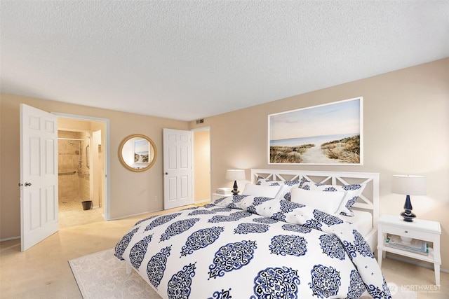 908 E Bay Dr NE Unit 203, Olympia, WA 98506 - bedroom featuring a textured ceiling and connected bathroom