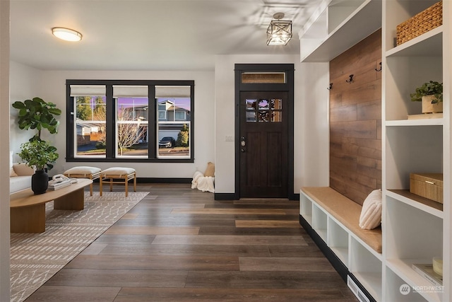 entryway with dark hardwood / wood-style floors