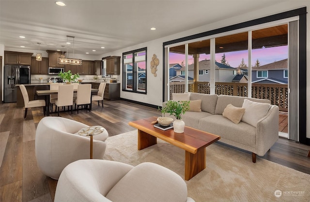 living room featuring hardwood / wood-style floors and a healthy amount of sunlight