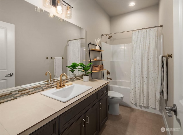 full bathroom with tasteful backsplash, vanity, shower / bath combination with curtain, and toilet