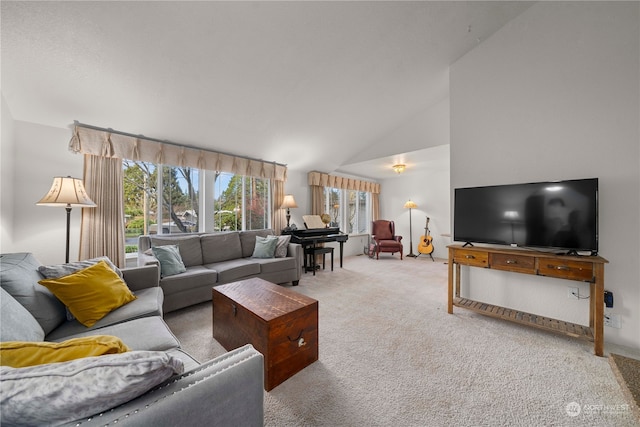 living room featuring light colored carpet and high vaulted ceiling