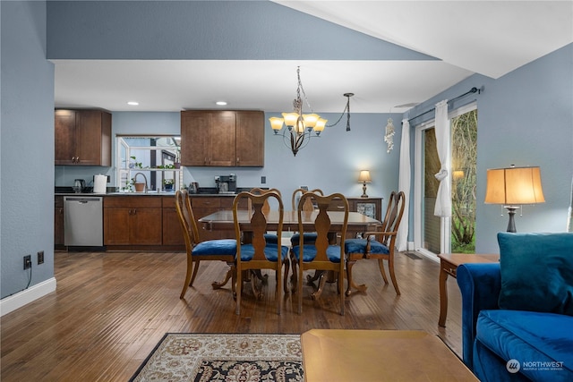 dining room with a chandelier, dark hardwood / wood-style flooring, and sink