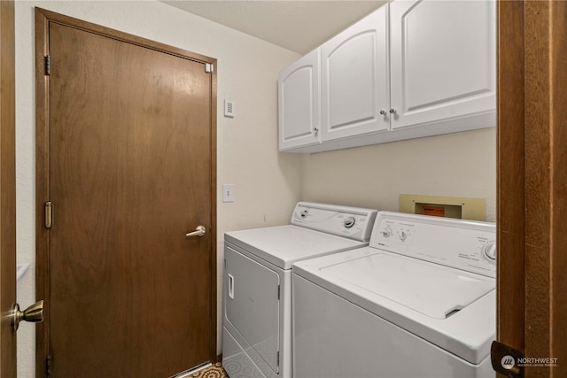 laundry area with cabinets and separate washer and dryer