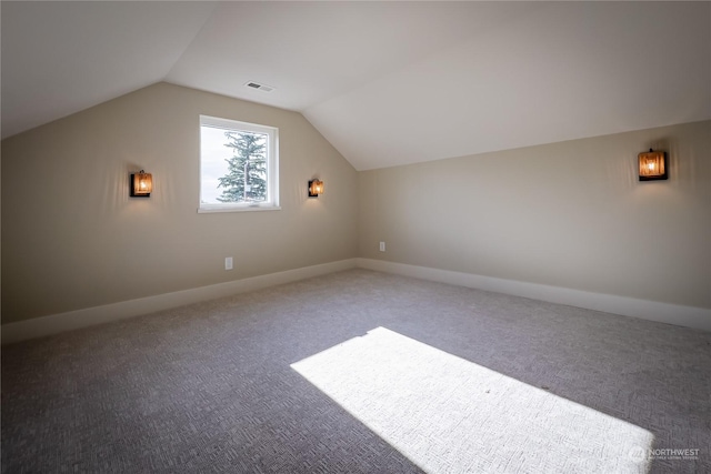 bonus room with carpet and lofted ceiling