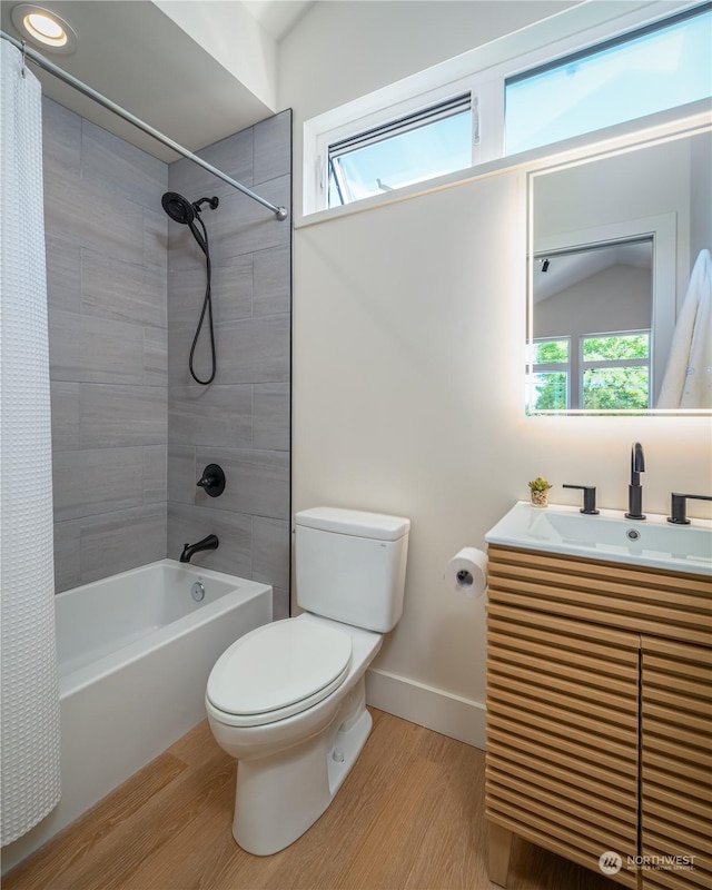 full bathroom featuring lofted ceiling, shower / bath combination with curtain, sink, toilet, and wood-type flooring