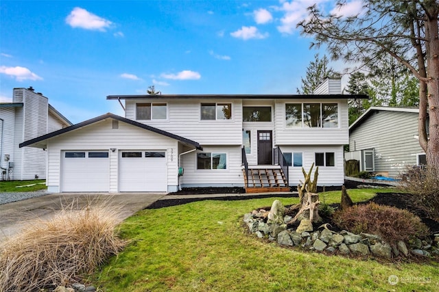 bi-level home with a front lawn and a garage