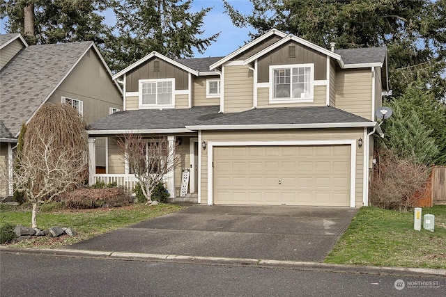 view of front facade featuring covered porch and a garage