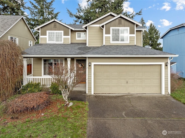 view of front of home with covered porch and a garage