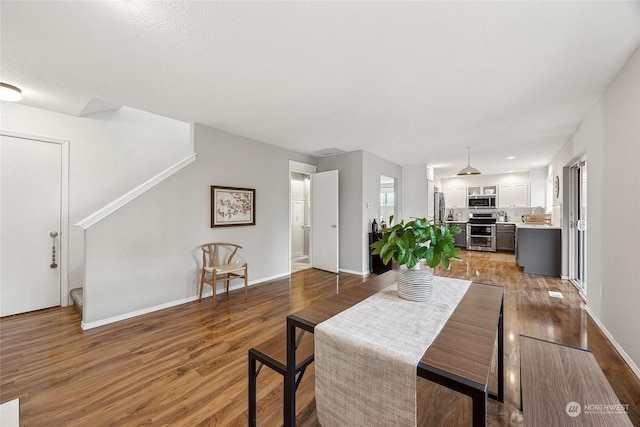 dining area with hardwood / wood-style floors