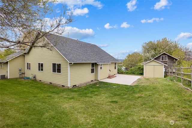 back of property with central AC, a yard, a shed, and a patio