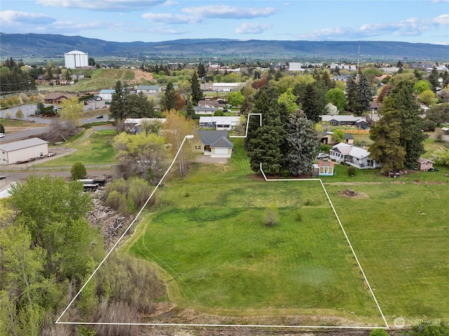 drone / aerial view featuring a mountain view