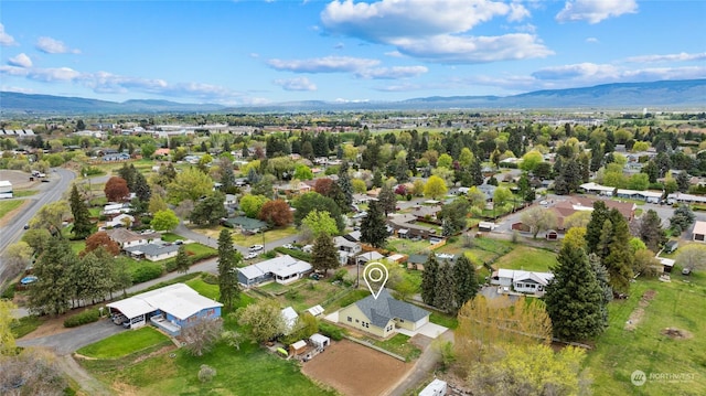 birds eye view of property with a mountain view