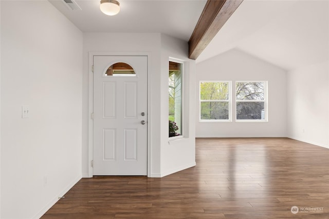 entrance foyer with dark hardwood / wood-style floors and vaulted ceiling with beams