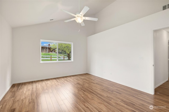 unfurnished room with lofted ceiling, hardwood / wood-style flooring, and ceiling fan