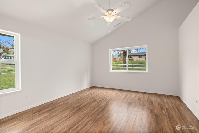 unfurnished room with wood-type flooring, high vaulted ceiling, a healthy amount of sunlight, and ceiling fan