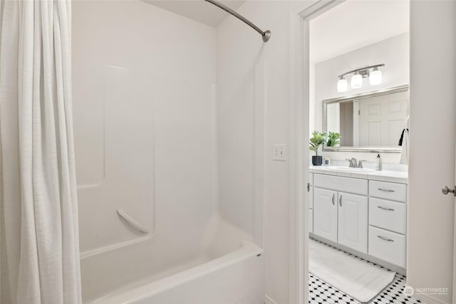 bathroom with shower / tub combo and vanity