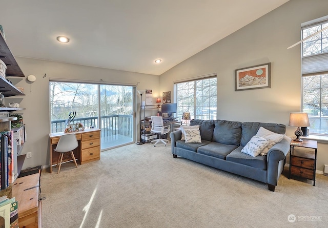 living room with vaulted ceiling and light carpet