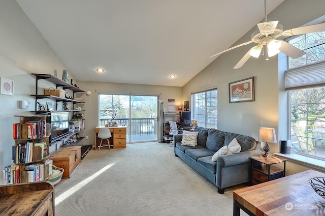 living room with light carpet, ceiling fan, and lofted ceiling