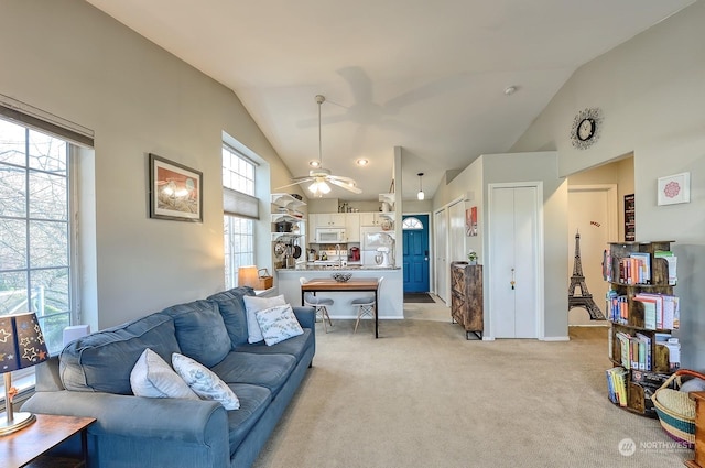 carpeted living room featuring lofted ceiling and ceiling fan