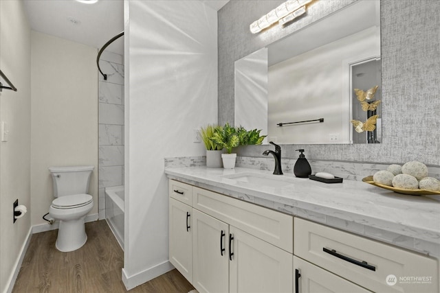 full bathroom with toilet, vanity, shower / bath combination, and hardwood / wood-style flooring