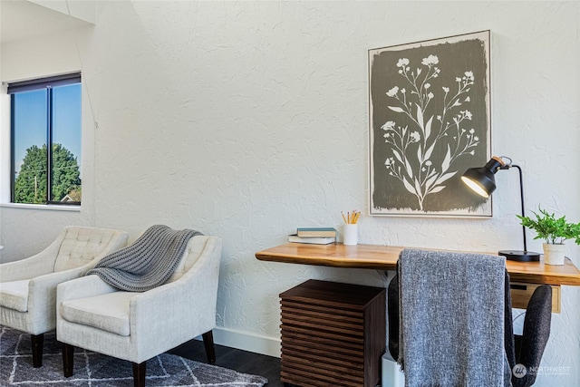 sitting room with dark hardwood / wood-style flooring