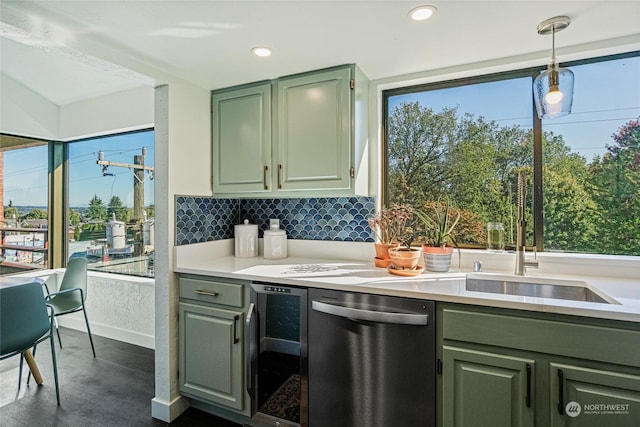 kitchen featuring dishwasher, sink, wine cooler, decorative light fixtures, and decorative backsplash