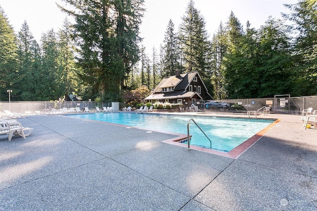 view of swimming pool featuring a patio area